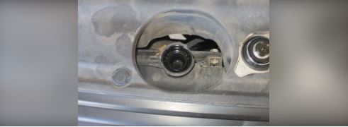 remove the radiator cap and ensure the coolant reaches the bottom of the filler neck