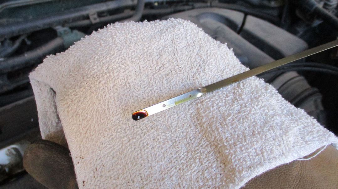 Check fluids with a towel and a dipstick