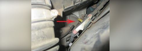 Locate the dipstick (if equipped) and withdraw it from the tube.