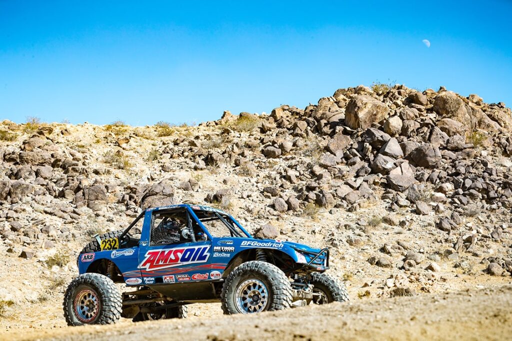Amsoil terrain truck on a dirt road